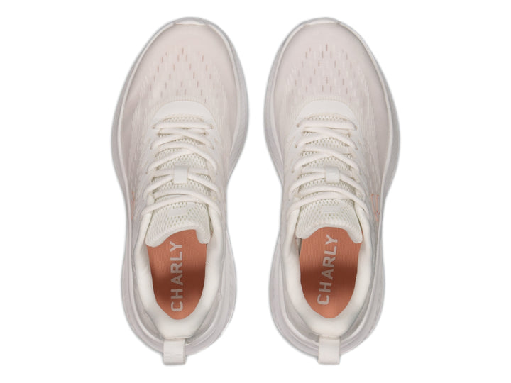 Tenis deportivos Charly color blanco con suela amortiguada y tejido transpirable.