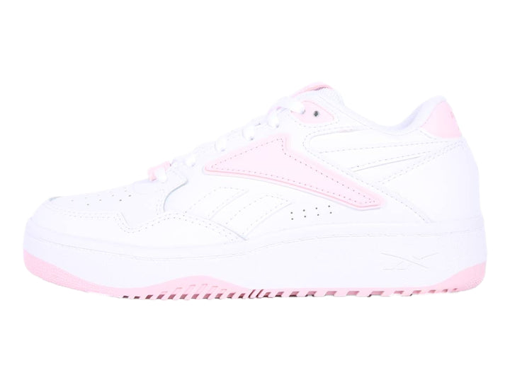 Tenis Reebok blancos con detalles en color rosa, diseño deportivo para niños.