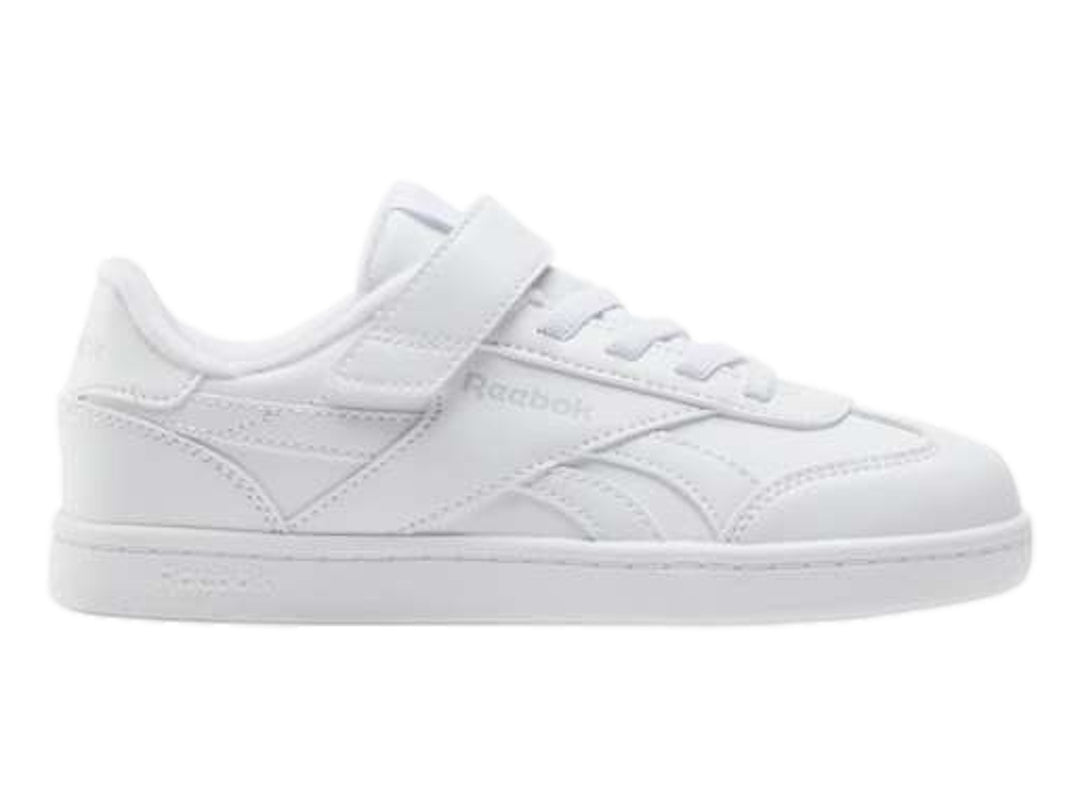 Tenis blancos Reebok de corte bajo con correa ajustable y agujetas.