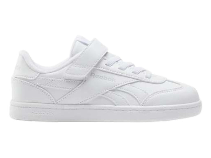 Tenis blancos Reebok de corte bajo con correa ajustable y agujetas.