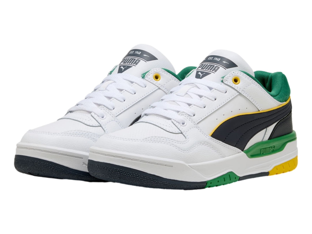 Tenis PUMA Rebound Retro blancos con acentos en verde, azul marino y amarillo.