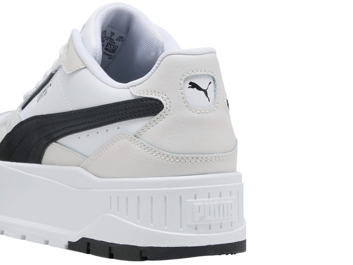 Tenis PUMA modelo Carmen II L en color blanco con detalles en negro y gris, con suela de plataforma elevada.