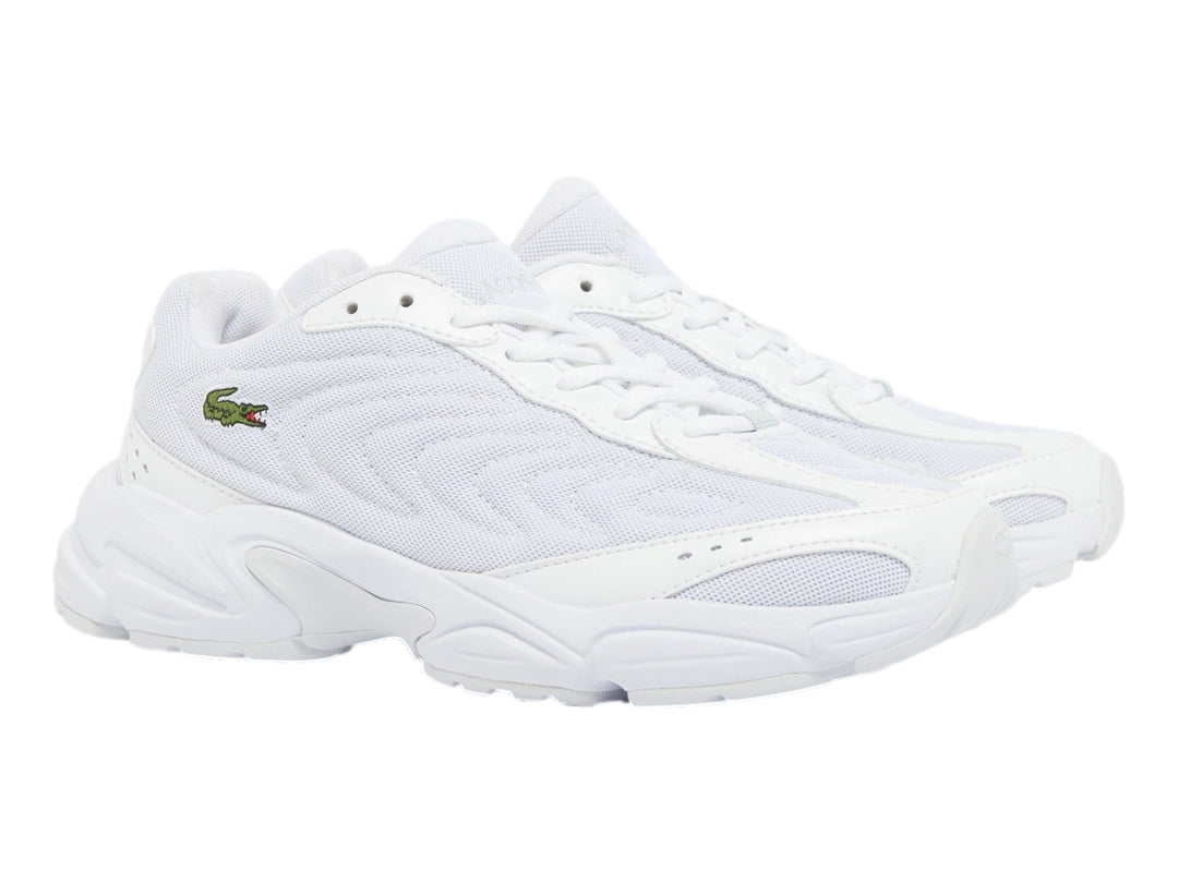 Tenis deportivos Lacoste color blanco con suela ancha y diseño moderno en malla sintética.
