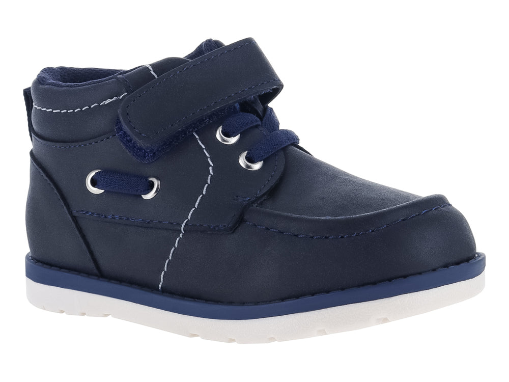 Zapato infantil VAVITO color azul marino con cierre de velcro y suela blanca.