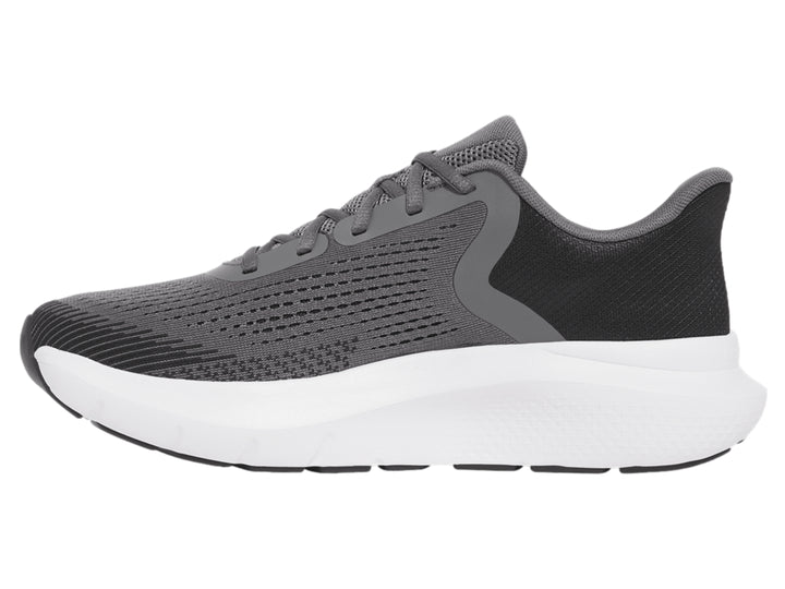 Tenis deportivos Under Armour color gris con suela blanca y logo dorado.