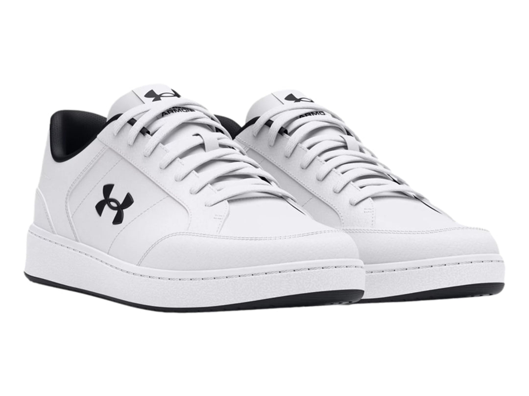 Tenis deportivos Under Armour de color blanco con logotipo y detalles en negro, vista lateral.
