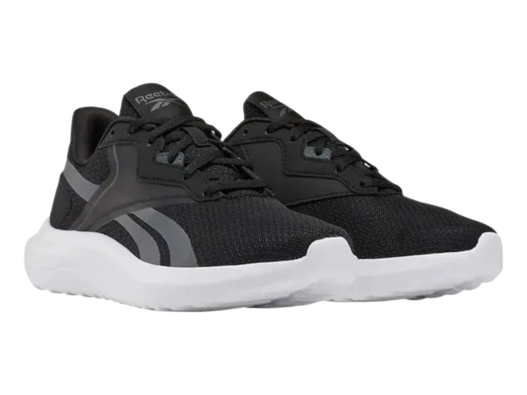 Tenis deportivos Reebok Energen Lux en color negro con suela blanca y detalles en gris.