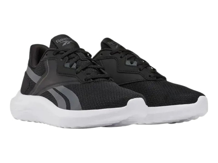 Tenis deportivos Reebok Energen Lux en color negro con suela blanca y detalles en gris.