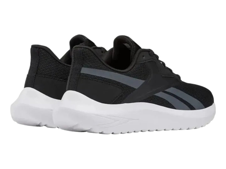 Tenis deportivos Reebok Energen Lux en color negro con suela blanca y detalles en gris.