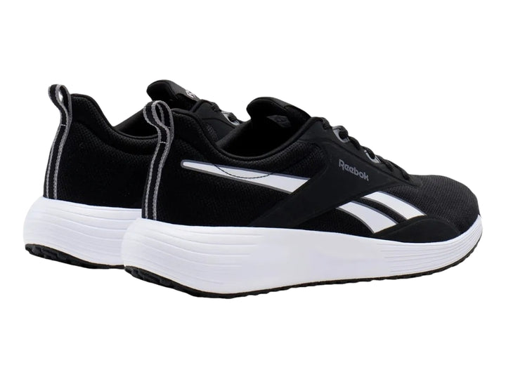 Tenis deportivos Reebok color negro con suela blanca y detalles laterales blancos.
