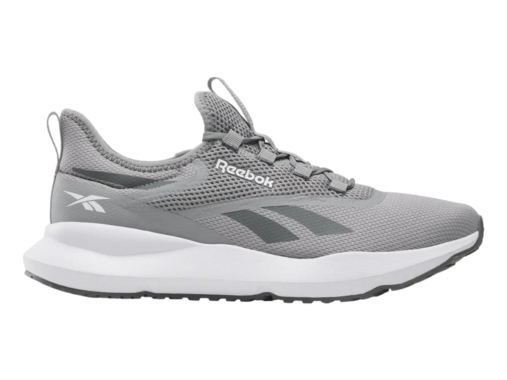 Tenis deportivos Reebok color gris con suela blanca y tejido de malla.