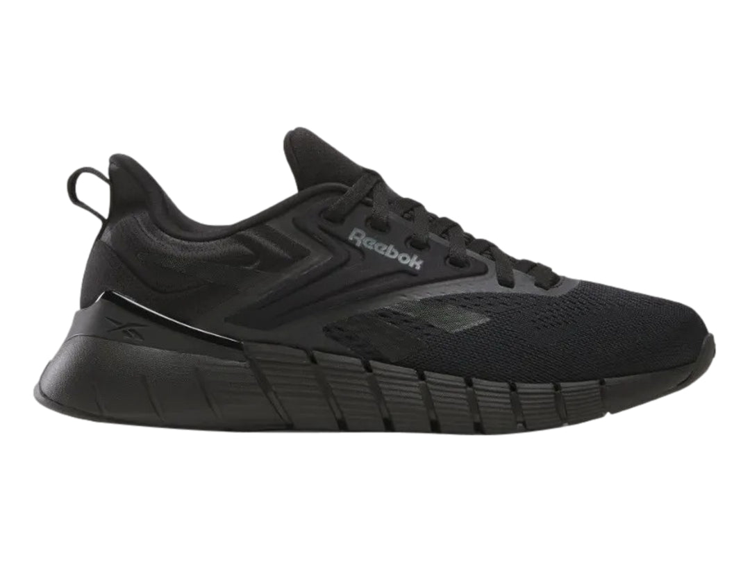 Tenis deportivos Reebok Nano Gym color negro para hombre, vista lateral.
