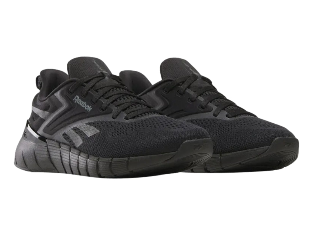 Tenis deportivos Reebok Nano Gym color negro para hombre, vista lateral.
