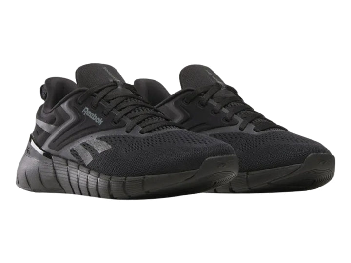 Tenis deportivos Reebok Nano Gym color negro para hombre, vista lateral.