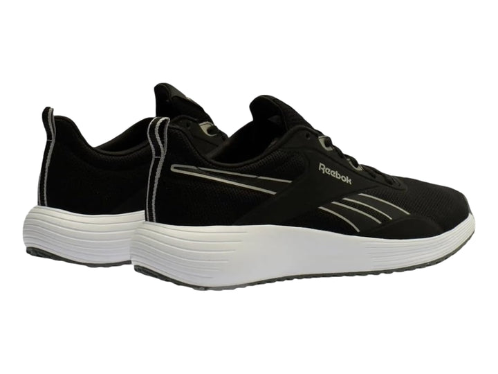 Tenis deportivos Reebok color negro con suela blanca y detalles en plata.