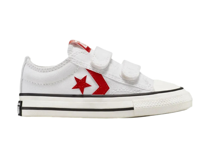 Tenis Converse blancos con cierre de velcro y logotipo de estrella roja.