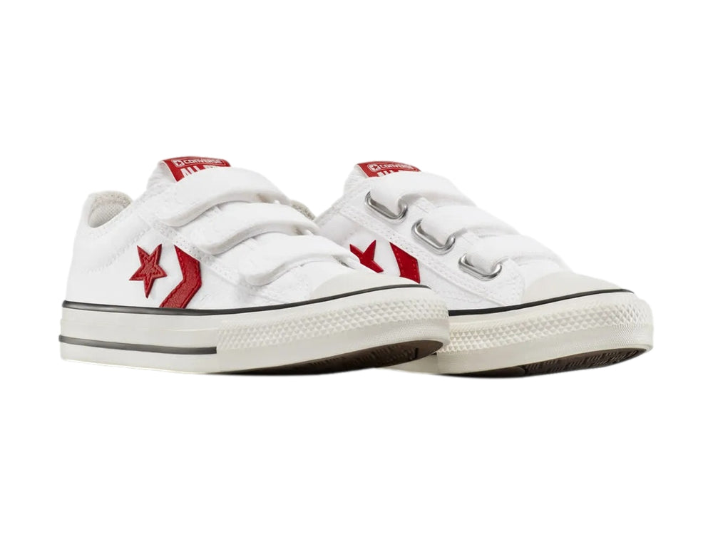Tenis Converse blancos con cierre de velcro y logotipo de estrella roja.