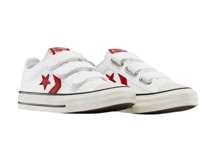 Tenis Converse blancos con cierre de velcro y logotipo de estrella roja.