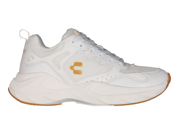 Tenis deportivos Charly blancos con detalles dorados y suela color caramelo.