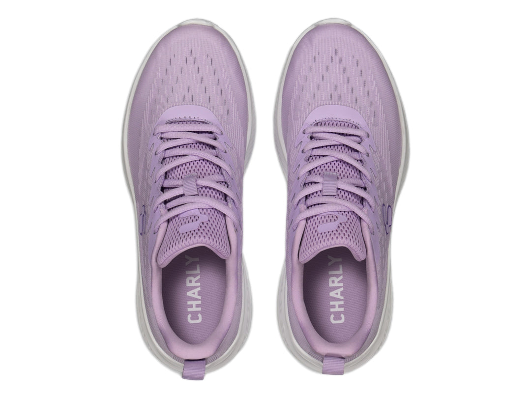 Tenis deportivos Charly de color lila con suela blanca, vista lateral.