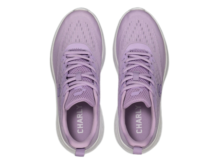 Tenis deportivos Charly de color lila con suela blanca, vista lateral.