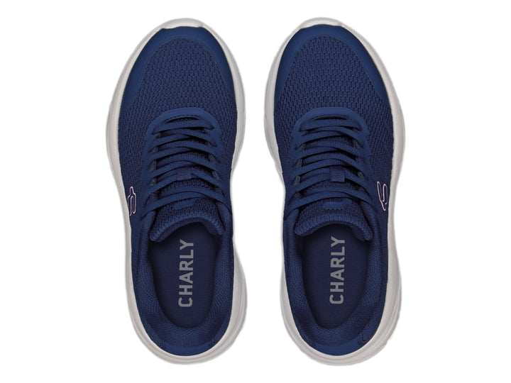 Tenis deportivos Charly color azul marino con suela blanca y detalle en rosa.