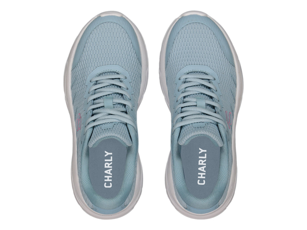 Tenis deportivos Charly color aqua con suela blanca y logotipo fucsia.