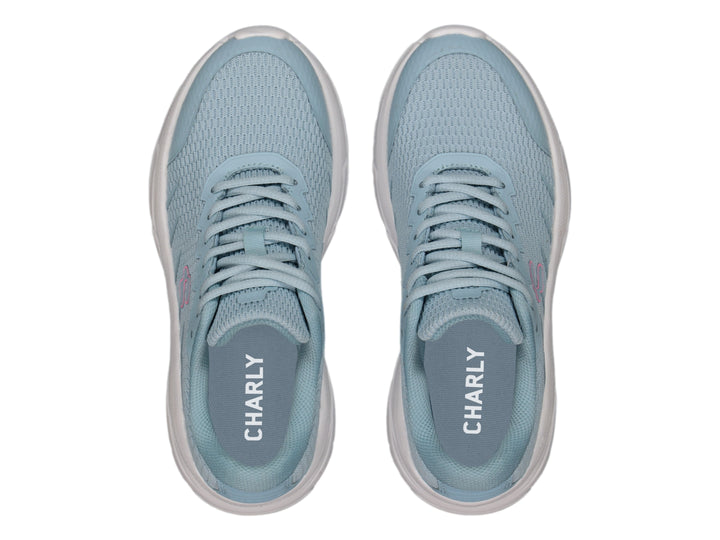 Tenis deportivos Charly color aqua con suela blanca y logotipo fucsia.