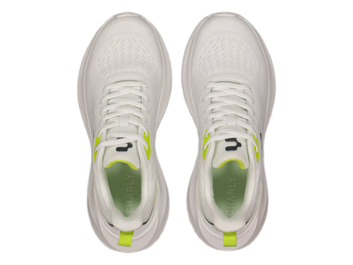 Tenis deportivos Charly color blanco con detalles en verde lima y suela blanca.