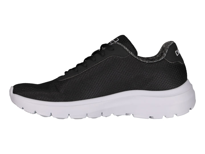 Tenis deportivos Charly color negro con suela blanca y logotipo blanco en el costado.
