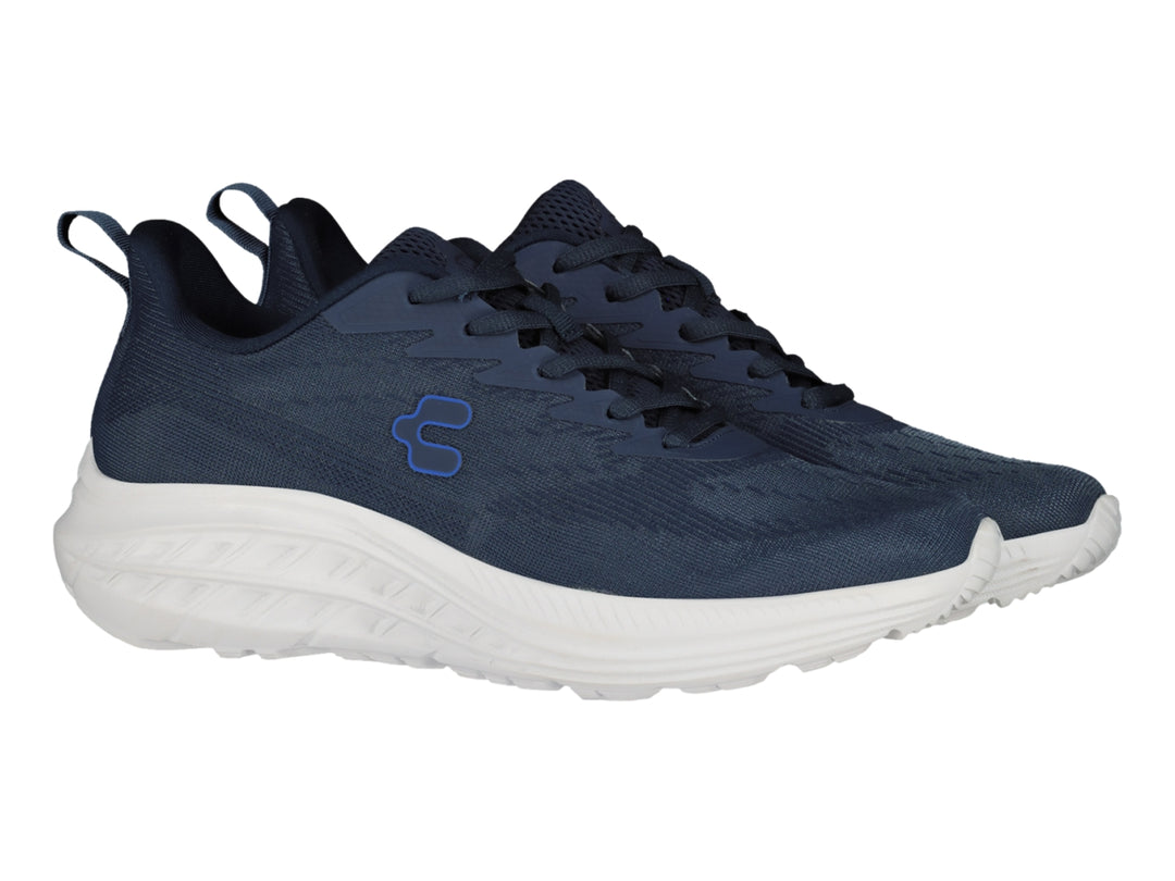Tenis deportivos Charly color azul marino con suela blanca.