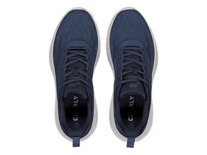 Tenis deportivos Charly color azul marino con suela blanca.