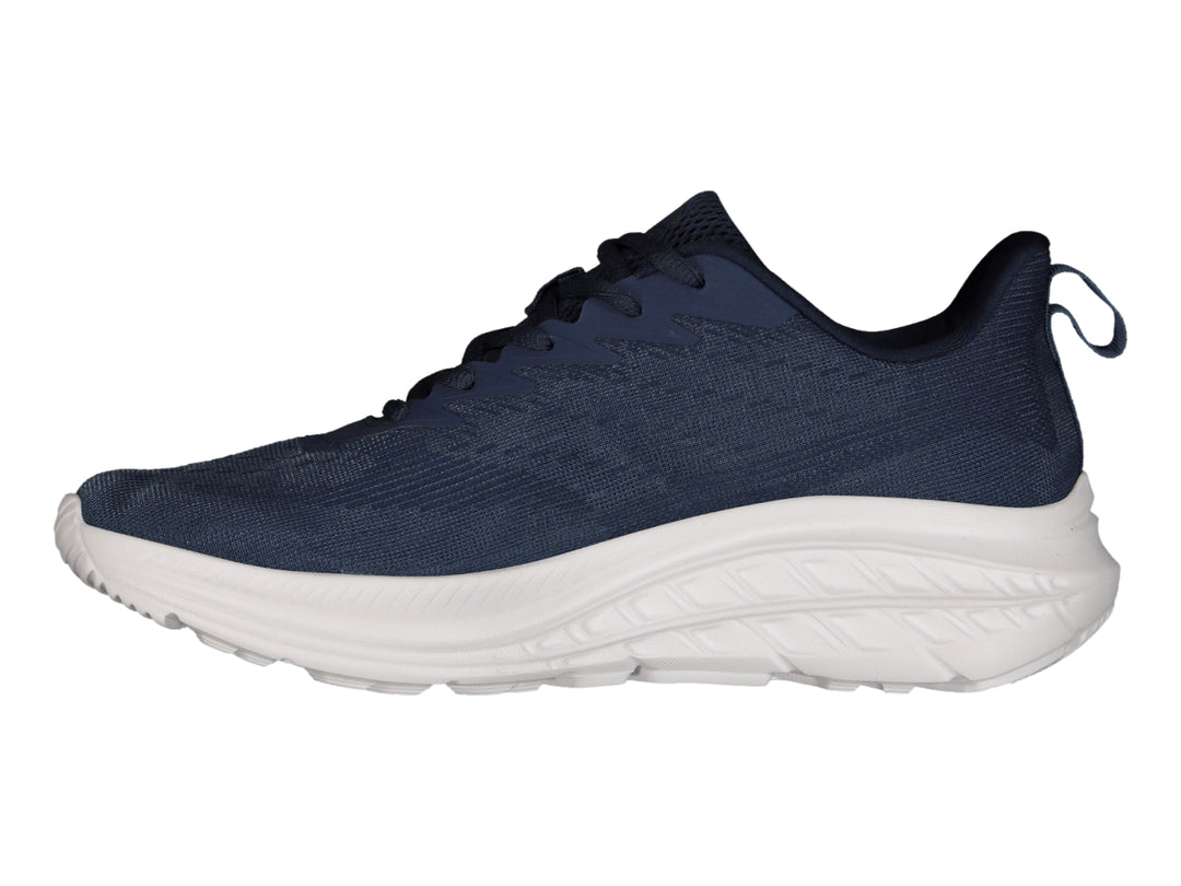 Tenis deportivos Charly color azul marino con suela blanca.
