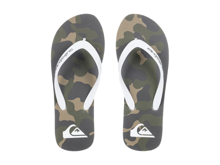 Sandalias Quiksilver color beige con tiras blancas y suela negra, estilo casual para playa.
