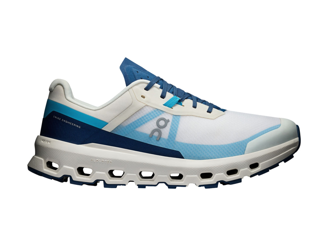Tenis deportivos On Cloud en colores blanco y azul con suela amortiguada y malla transpirable.