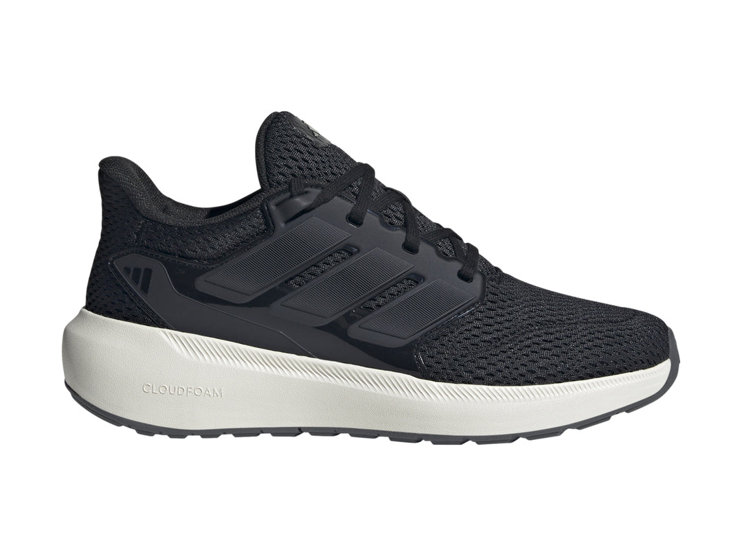 Tenis deportivos Adidas color negro con suela blanca y tejido de malla.