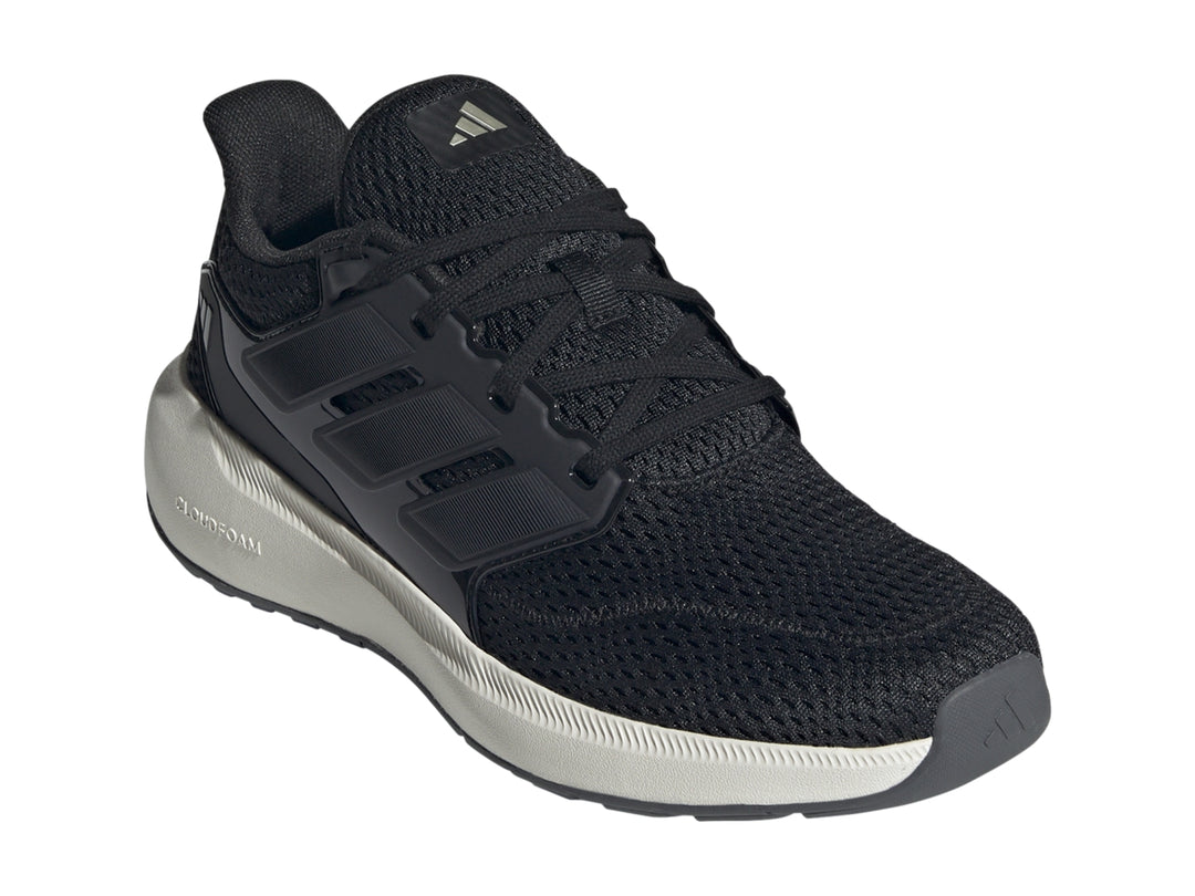 Tenis deportivos Adidas color negro con suela blanca y tejido de malla.