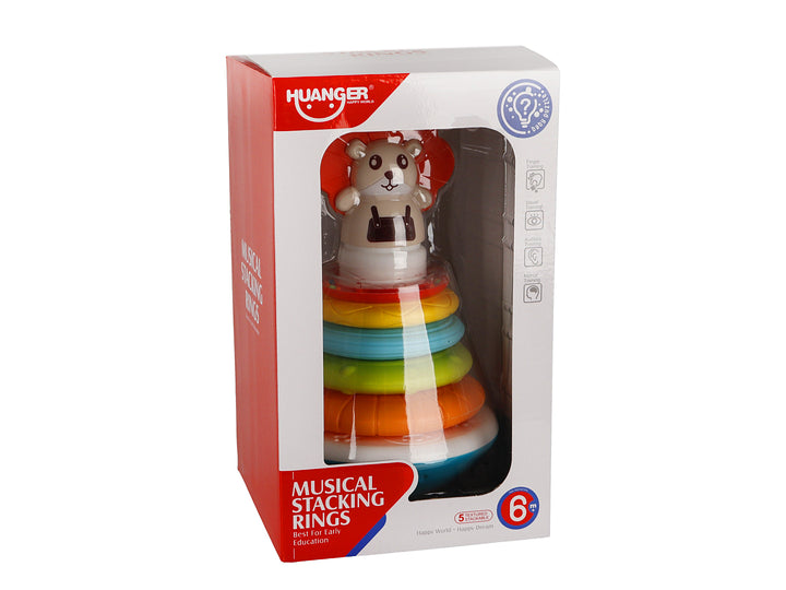 Juguete interactivo de anillos apilables multicolores con una figura de oso en la parte superior, presentado en su caja.