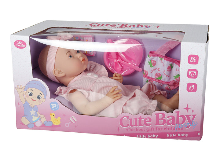 Muñeca bebé con ropa y accesorios en color rosa dentro de su caja de empaque.