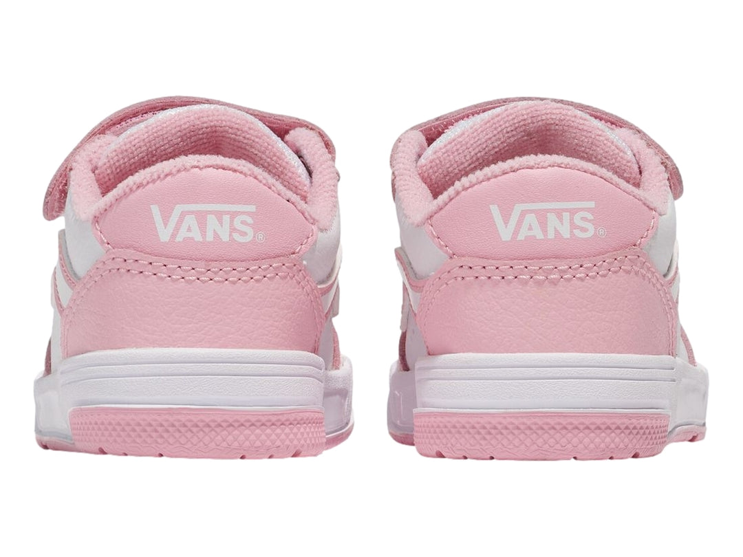 Tenis infantiles Vans color rosa y blanco con correa de velcro y suela blanca.