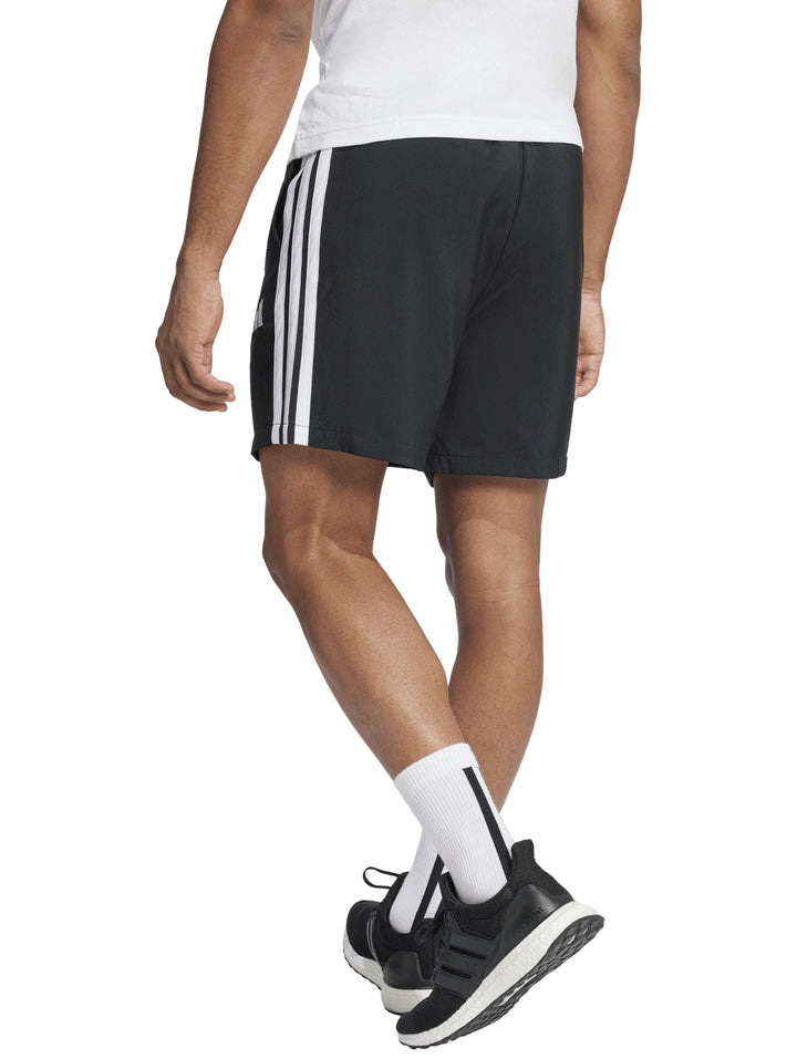Pantalones cortos deportivos Adidas color negro con tres franjas blancas laterales y logo blanco.