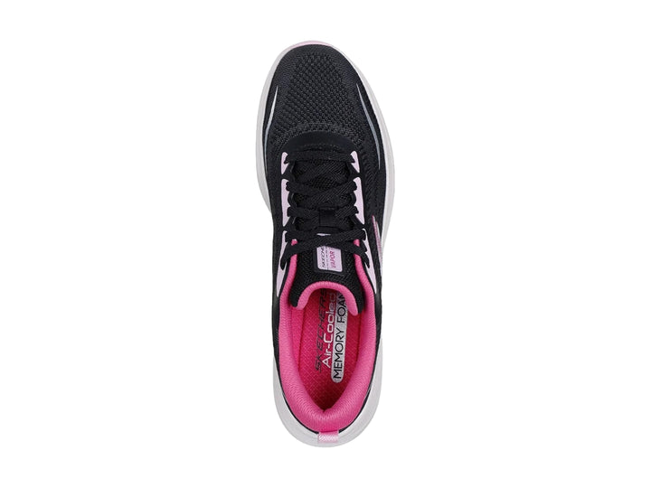 Tenis deportivos Skechers color negro con suela blanca y detalles en rosa.