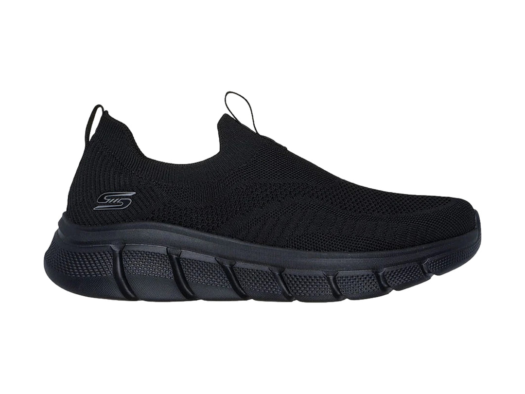 Tenis Skechers color negro, estilo slip-on con tejido transpirable y suela flexible.