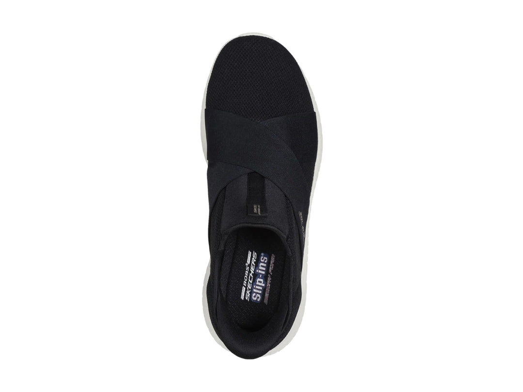 Tenis Skechers Slip-ins color negro con suela blanca, diseño deportivo y sin cordones.