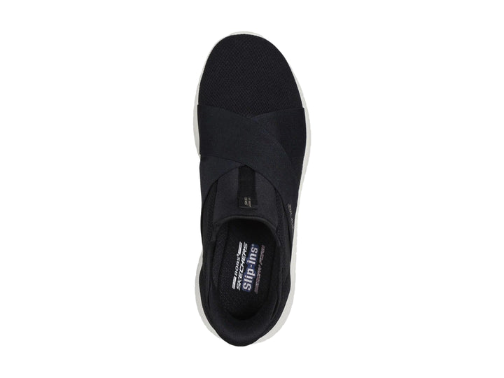 Tenis Skechers Slip-ins color negro con suela blanca, diseño deportivo y sin cordones.