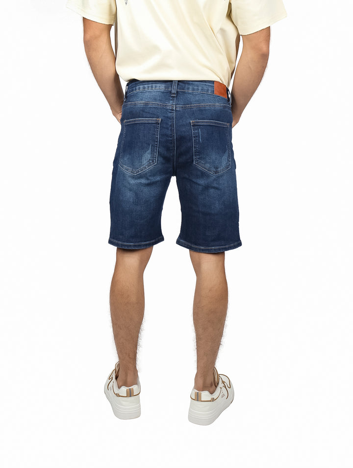 Bermuda de mezclilla azul con efecto de destrucción para hombre.