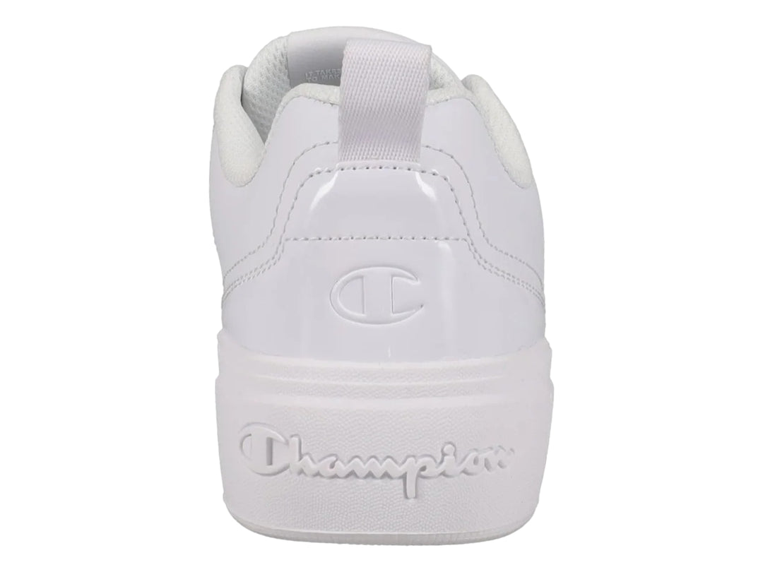 Tenis blancos Champion con detalle floral grabado en el lateral y suela blanca.