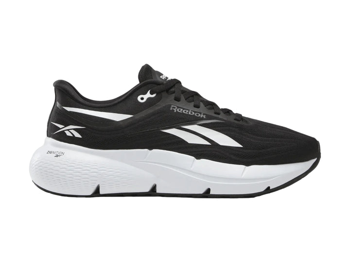 Tenis deportivos Reebok color negro con suela blanca y detalles laterales blancos.