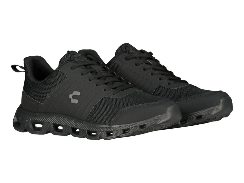 Tenis deportivos Charly color negro con suela texturizada y malla transpirable.