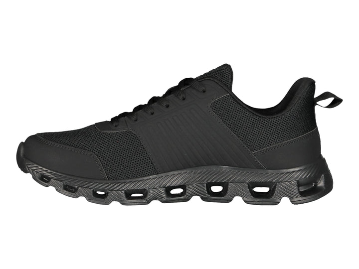 Tenis deportivos Charly color negro con suela texturizada y malla transpirable.